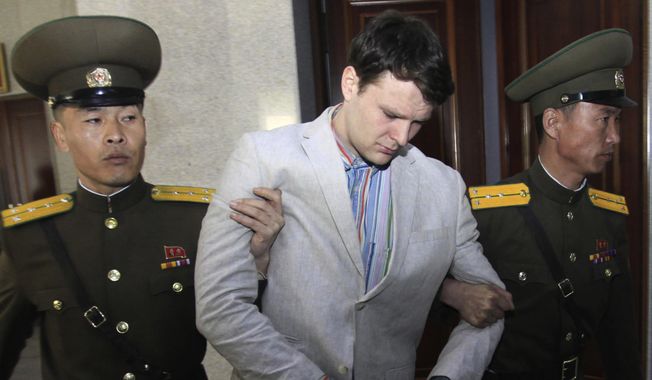 In this March 16, 2016, file photo, American student Otto Warmbier, center, is escorted at the Supreme Court in Pyongyang, North Korea. In remarks at a Sept. 20, 2019, news conference, President Trump blamed his predecessor&#x27;s administration for not having &quot;moved faster&quot; to secure Warmbier&#x27;s release. (AP Photo/Jon Chol Jin, File) **FILE**