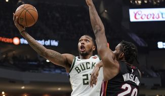 File-This Jan. 15, 2019, file photo shows Milwaukee Bucks&#39; Sterling Brown driving past Miami Heat&#39;s Justise Winslow during the second half of an NBA basketball game in Milwaukee. Nearly a year after police fatally shot an unarmed black man in Sacramento and a series of protests ensued in California&#39;s capital, the Kings and Milwaukee Bucks collaborated on a daylong summit Wednesday, Feb. 27, 2019, to address social injustice and encourage engagement and thoughtful discussions to try to bring about change. &amp;quot;Whenever the team can do something as big as this for the community, it&#39;s important,&amp;quot; Brown said after the Bucks&#39; morning shoot-around. (AP Photo/Morry Gash, File)