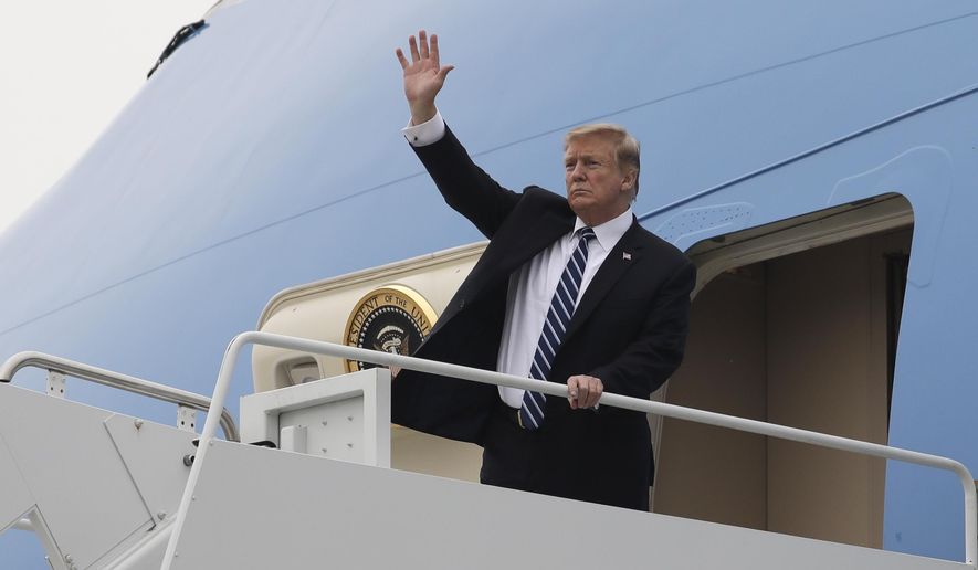 President Donald Trump waves as he boards Air Force One after a summit with North Korean leader Kim Jong Un, Thursday, Feb. 28, 2019, in Hanoi. (AP Photo/ Evan Vucci)