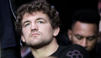 FILE - In this Nov. 3, 2018, file photo, UFC fighter Ben Askren waits for the start of a middleweight mixed martial arts bout between David Branch and Jared Cannonier at UFC 230, in New York. Askren is finally making his UFC debut after a decade in mixed martial arts and a lifetime of wrestling. (AP Photo/Julio Cortez, File)