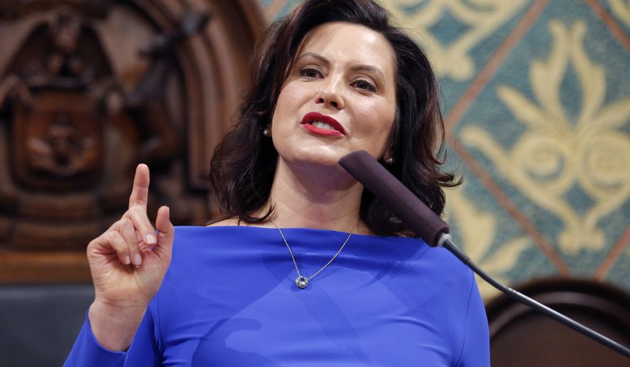 FILE - In this Feb. 12, 2019 file photo, Michigan Gov. Gretchen Whitmer delivers her State of the State address to a joint session of the House and Senate at the state Capitol in Lansing, Mich. Whitmer is abolishing Michigan&#39;s medical marijuana licensing board and folding its functions into a newly created regulatory agency. The Democrat issued an executive order Friday, March 1, 2019, to create the Marijuana Regulatory Agency. The board has been criticized as too slow to issue licenses following a law that instituted a tiered regulatory system. (AP Photo/Al Goldis, File)