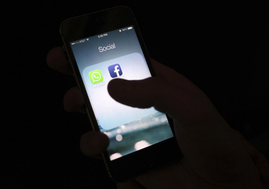 This Feb. 19, 2014, file photo shows the Facebook app icon on an iPhone in New York. (AP Photo/Karly Domb Sadof, File)