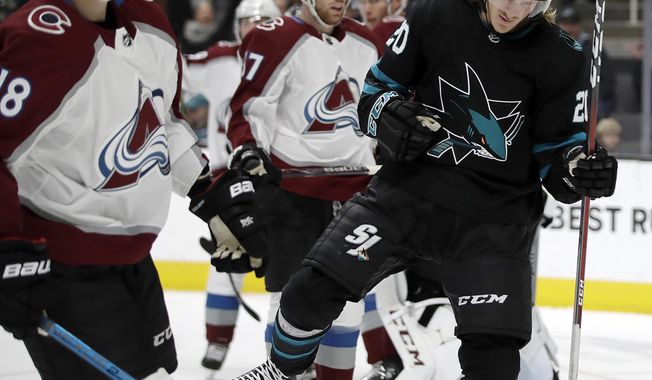 San Jose Sharks&#x27; Marcus Sorensen, right, celebrates beside Colorado Avalanche&#x27;s Derick Brassard, (18) after scoring a goal during the first period of an NHL hockey game Friday, March 1, 2019, in San Jose, Calif. (AP Photo/Ben Margot)