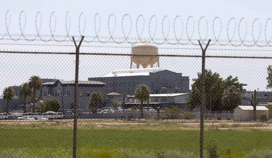 FILE - In this July 23, 2014, file photo, a fence surrounds the state prison in Florence, Ariz. Arizona legislators are moving to tighten the state's law on capital punishment by eliminating three of the 14 so-called "aggravating factors" than can be the basis for imposing a death sentencing. (AP Photo/File)