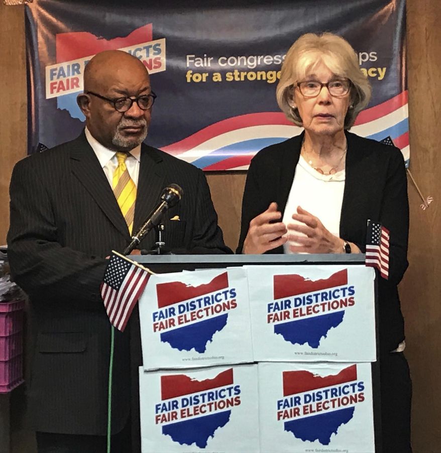 File-In this Jan. 22, 2018, file photo, fair Congressional Districts for Ohio members Ann Henkener, right, of the League of Women Voters, and Sam Gresham, of Common Cause Ohio, react to a competing redistricting proposal by state Rep. Matt Huffman (R-Lima) during a news conference in Columbus, Ohio. Voting rights groups that charge that Ohio’s congressional map was unfairly manipulated by state Republicans will have their say in federal court. The trial for a lawsuit filed last year is scheduled to open Monday, March 4, 2019, in Cincinnati. The suit challenges the district maps in effect through 2020 for "an unconstitutional partisan gerrymander" that violates voters' rights. (AP Photo/Julie Carr Smyth, File)