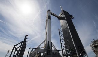 In this image released by NASA, a Falcon 9 SpaceX rocket, ready for launch, sits on pad 39A at the Kennedy Space Center in Cape Canaveral, Fla., Friday, March 1, 2019. The spacecraft&#39;s unmanned test flight with the Dragon capsule is scheduled for launch early Saturday morning. (Joel Kowsky/NASA via AP)