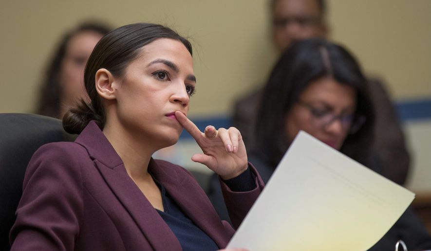 &quot;He&#39;s not on my payroll. They were not working for me and they were two separate entities here,&quot; Rep. Alexandria Ocasio-Cortez said. (Associated Press)