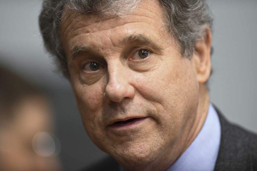 U.S. Sen. Sherrod Brown, D-Ohio, speaks to reporters during the Martin Luther and Coretta Scott King Unity Breakfast Sunday, March 3, 2019, in Selma, Ala. Several Democratic White House hopefuls are visiting one of America's seminal civil rights sites to pay homage to that legacy and highlight their own connections to the movement. (AP Photo/Julie Bennett)