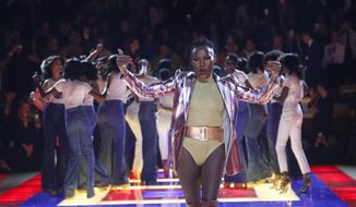 Singer Grace Jones wears a creation as part of the Tommy Now ready to wear Fall-Winter 2019-2020 collection, that was presented in Paris, Saturday, March 2, 2019. (AP Photo/Michel Euler)