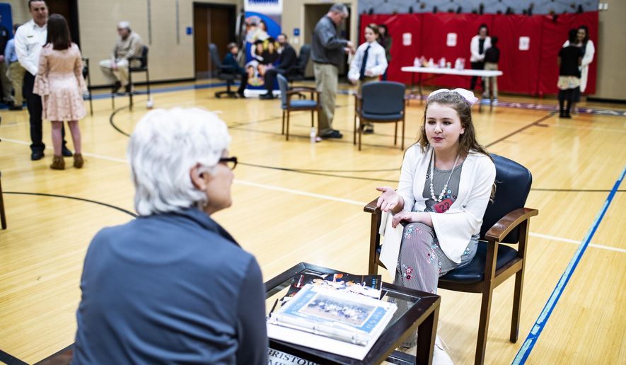 Halee Butler, right, talks to Martha Madison of Bowling Green during The Amazing Shake on Tuesday, Feb. 26, 2019, at Bristow Elementary School in Bowling Green, Ky. (Austin Anthony/Daily News via AP)