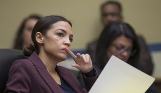 Rep. Alexandria Ocasio-Cortez, D-N.Y., listens to questions as Michael Cohen, President Donald Trump&#39;s former personal lawyer, testifies before the House Oversight and Reform Committee on Capitol Hill in Washington on Feb. 27, 2019. (AP Photo/Alex Brandon) ** FILE **