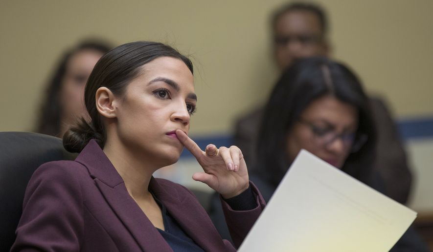 Rep. Alexandria Ocasio-Cortez, D-N.Y., listens to questions as Michael Cohen, President Donald Trump&#x27;s former personal lawyer, testifies before the House Oversight and Reform Committee on Capitol Hill in Washington on Feb. 27, 2019. (AP Photo/Alex Brandon) ** FILE **