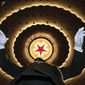 A Chinese military band conductor rehearses before the opening session of the annual National People&#39;s Congress in Beijing&#39;s Great Hall of the People, Tuesday, March 5, 2019. (AP Photo/Ng Han Guan)