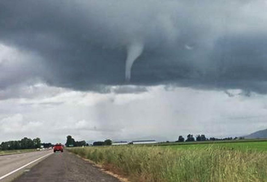 This photo provided by James Lally shows a funnel-shaped cloud  on I-10 near Marianna, Fla., Sunday, March 3, 2019. Numerous tornado warnings were posted across parts of Alabama, Georgia, Florida and South Carolina on Sunday afternoon as the powerful storm system raced across the region. (James Lally via AP)