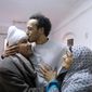 Mahmoud Abu Zaid, a photojournalist known as Shawkan, center, is hugged by his parents at his home in Cairo, Egypt, Monday, March 4, 2019. Shawkan was released after after five years in prison. (AP Photo/Amr Nabil)