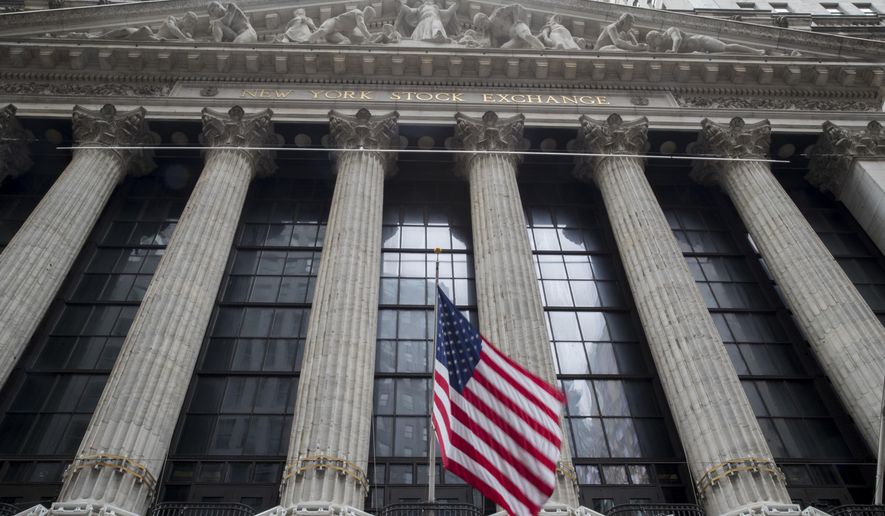 FILE- In this Nov. 20, 2018, file photo an American flag flies outside New York Stock Exchange. Stocks are opening broadly higher on Wall Street following reports that the U.S. and China are getting closer to a deal on trade. Technology stocks, industrial and internet companies were among the biggest gainers in early trading Monday, March 4, 2019. (AP Photo/Mary Altaffer, File)