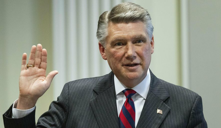 FILE - In this Feb. 21, 2019, file photo, Mark Harris, Republican candidate in North Carolina&#39;s 9th Congressional race, prepares to testify during the fourth day of a public evidentiary hearing on the 9th Congressional District voting irregularities investigation at the North Carolina State Bar in Raleigh, N.C. North Carolina’s elections board is expected to decide Monday, March 4 when to hold new party primaries and the general election for the 9th congressional district, where a seat still remains vacant after November’s result was tainted by ballot fraud concerns. Democrat Dan McCready is running again in the new election. Harris will not. (Travis Long/The News &amp;amp; Observer via AP, Pool, File)