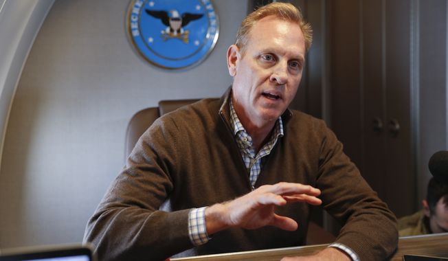 Acting Secretary of Defense Patrick Shanahan gestures while speakings to members of the media aboard a military plane prior to his arrival at Andrews Air Force Base, Md., Saturday, Feb. 23, 2019. Shanahan spoke about the US-Mexico border after visiting the El Paso, Texas area. (AP Photo/Pablo Martinez Monsivais, Pool)