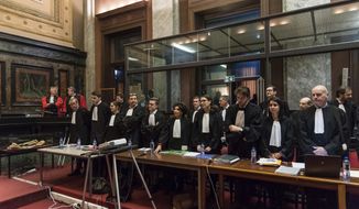 Lawyers attend the trial of Mehdi Nemmouche at the Justice Palace in Brussels, Thursday, Feb. 28, 2019.  The defense lawyer Thursday is summing up the case for Nemmouche, who is charged with “terrorist murder” over the 2014 slaying of an Israeli couple and two employees at the Jewish museum in Brussels, about a week before the verdict is expected to be handed down.(AP Photo/Geert Vanden Wijngaert, Pool)