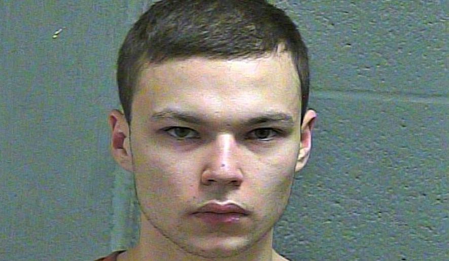 This March 4, 2019 booking photo released b y Oklahoma County Sheriff's Office shows Michael Elijah Walker. Police say the 19-year-old Oklahoma man told his younger brother that he fatally shot their parents because they were communicating with him telepathically and were Satan worshippers. Investigators say in an affidavit released Tuesday, March 5, 2019, that the younger brother called Edmond police early Monday after waking to his mother's screams and the sound of gunshots. (Oklahoma County Sheriff's Office via AP)