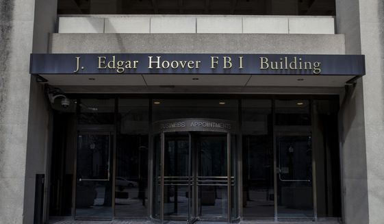 The J. Edgar Hoover FBI Building is shown on Monday, March 4, 2019, in Washington. (AP Photo/Alex Brandon) ** FILE **