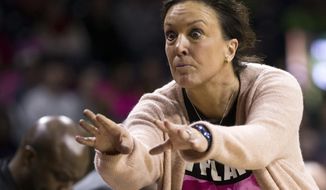 FILE - In this Feb. 11, 2018, file photo, Georgia Tech head coach MaChelle Joseph mimics one of her players after a pass was deflected during the second half of an NCAA college basketball game against Notre Dame, in South Bend, Ind. Assistant coach Mark Simons is left to keep Georgia Tech&#39;s shell-shocked team together entering its ACC tournament game against North Carolina on Thursday, March 7, 2019, without its coach, MaChelle Joseph, who was suspended last week without explanation.(AP Photo/Robert Franklin, File)
