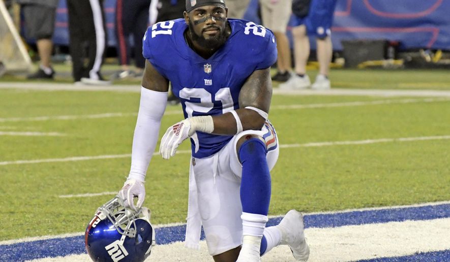 FILE - In this Sept. 30, 2018, file photo, New York Giants&#x27; Landon Collins kneels in the end zone during an NFL football game against the New Orleans Saints in East Rutherford, N.J. The Giants apparently have decided not to put a franchise tag on three-time Pro Bowl safety. The Giants’ leading tackler in each of his four seasons with the team, Collins on Tuesday, March 5, 2019, thanked the organization for four great years in a tweet and said he was looking forward to the next chapter of his football career. (AP Photo/Bill Kostroun, File)