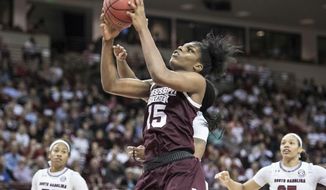 Mississippi State center Teaira McCowan (15) grabs a rebound during the second half of an NCAA college basketball game against South Carolina, Sunday, March 3, 2019, in Columbia, S.C. (AP Photo/Sean Rayford)