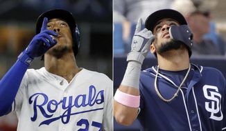 FILE - At left, in an Aug. 14, 2018, file photo, Kansas City Royals&#39; Adalberto Mondesi celebrates after hitting an RBI single during the fourth inning of a baseball game against the Toronto Blue Jays, in Kansas City, Mo. At right, in a Feb. 26, 2019, file photo, San Diego Padres&#39; Fernando Tatis Jr. celebrates after hitting a two-run home run during the third inning of a spring training baseball game against the Milwaukee Brewers, in Phoenix. The Padres&#39; Fernando Tatis Jr. and the Royals&#39; Adalberto Mondesi have never met, but it&#39;s probably long overdue. They&#39;d have a lot to talk about. Both are hot young shortstop prospects, with big league fathers and roots in the Dominican Republic. (AP Photo/Charlie Riedel, File)