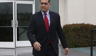 California Attorney General Xavier Becerra leaves leaves the Calvary Christian Center after meeting with SeQuette Clark, Tuesday, March 5, 2019, in Sacramento, Calif. Becerra is expected later today to announce the results of his criminal investigation into the shooting death of Clark&#39;s son, Stephon Clark, by Sacramento police officers last year. (AP Photo/Rich Pedroncelli)