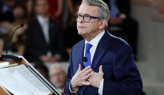 FILE - In this Jan. 14, 2019, Ohio Gov. Mike DeWine speaks during a public inauguration ceremony at the Ohio Statehouse, in Columbus, Ohio. DeWine is expected to push for an increase in Ohio’s gas tax and promote efforts to fight the opioid epidemic Tuesday, March 5 in his first State of the State speech as governor. The Republican is also expected to highlight programs he’s advocated to improve the lives of children. DeWine is bringing the event back to Columbus following the decision by his predecessor, Gov. John Kasich, to hold seven of eight speeches in cities around Ohio.   (AP Photo/John Minchillo, Pool, File)