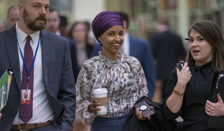 Rep. Ilhan Omar, D-Minn., walks through an underground tunnel at the Capitol as top House Democrats plan to offer a measure that condemns anti-Semitism in the wake of controversial remarks by the freshman congresswoman, in Washington, Wednesday, March 6, 2019. Omar said last week that Israel&#39;s supporters are pushing U.S. lawmakers to take a pledge of &quot;allegiance to a foreign country.&quot; Despite criticism from Democrats and Republicans, Omar has refused to apologize. (AP Photo/J. Scott Applewhite)
