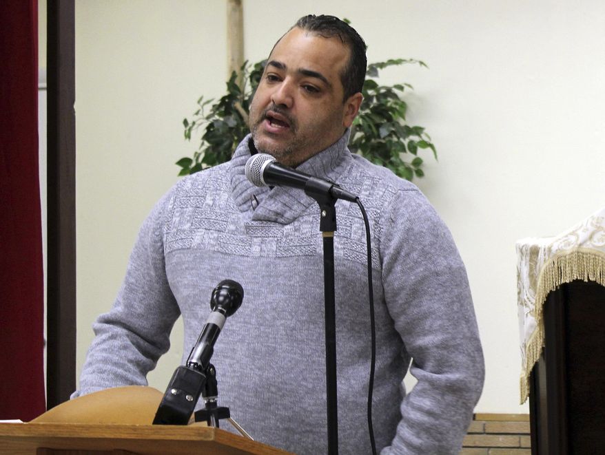 Small business owner Junior Hernandez speaks during a community forum at Capilla Evangelica Hispana, Wednesday, March 6, 2019, in Lawrence, Mass., to discuss the natural gas explosions that rocked the city last Sept. 13. Small business owners said during the forum that they're frustrated at the response from local officials and Columbia Gas, the utility company to blame for the disaster. (AP Photo/Philip Marcelo)