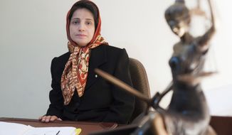 In this Nov. 1, 2008 photo, Iranian human rights lawyer Nasrin Sotoudeh, poses for a photograph in her office in Tehran, Iran. On Wednesday, March 6, 2019, the New York-based Center for Human Rights in Iran, said Sotoudeh, a prominent human rights lawyer in Iran who defended women protesting against the Islamic Republic&#39;s mandatory headscarf, has been convicted and faces years in prison.  Sotoudeh, who previously served three years in prison for her work, was convicted in absentia by a Revolutionary Court. She is currently held at Tehran&#39;s Evin prison. (AP Photo/Arash Ashourinia)