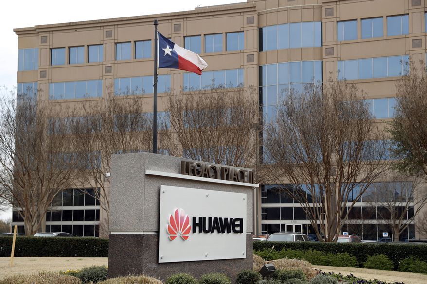 The Texas state flag files outside the Huawei Technologies Ltd. business location in Plano, Texas, Thursday, March 7, 2019. The Chinese tech giant is challenging a U.S. law that would limit its American sales of telecom equipment on security grounds as the company steps up efforts to preserve its access to global markets for next-generation communications. (AP Photo/Tony Gutierrez)