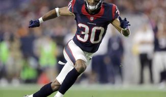 FILE - In this Aug. 22, 2015, file photo, Houston Texans&#39; Kevin Johnson (30) chases a play during the first half of an NFL preseason football game against the Denver Broncos in Houston. Johnson is scheduled to meet with the Browns, a person familiar with the visit confirmed to The Associated Press, Thursday, March 7, 2019. Johnson, who was released earlier this week by the Texans, met with the Buffalo Bills on Wednesday. (AP Photo/Patric Schneider, File)