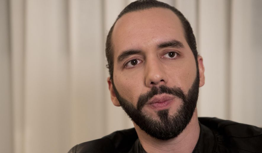 FILE - In this Jan. 29, 2019 file photo, presidential frontrunner Nayib Bukele listens to a question during an interview, in San Salvador, El Salvador. Bukele, who won the election and is El Salvador’s president-elect, has agreed to pay $50,000 to a former government minister who sued him for slander. (AP Photo/Moises Castillo, File)