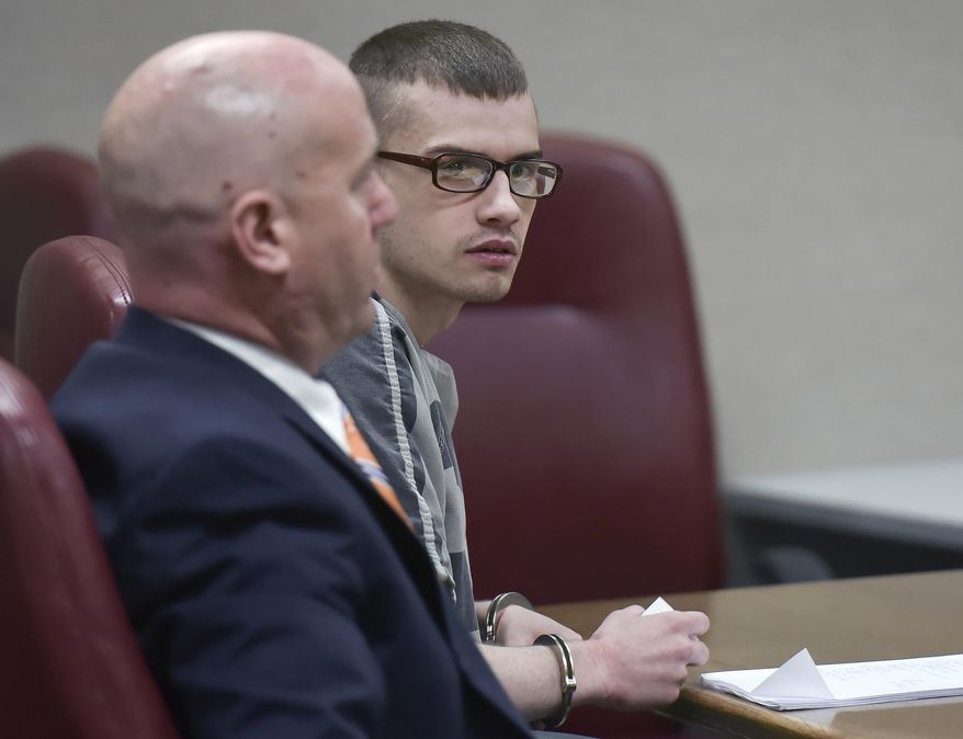 Robert Seth Denton, right, who is seated next to his attorney, Ricky Curtis, looks to the prosecutors during his sentencing hearing in a Sullivan County Tennessee Circuit Court Thursday, March 7, 2019, in Blountville, Tenn. In January 2019, a jury convicted Denton, 22, of three murder counts in the 2015 shootings of his mother, stepfather and grandmother in Tennessee. Denton was sentenced to life in prison without parole. (Andre Teague/Bristol Herald Courier via AP)