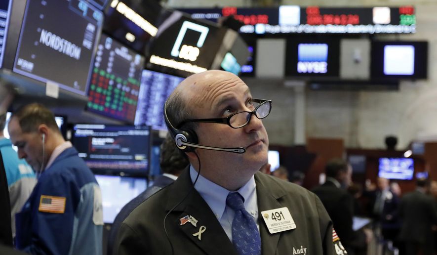 FILE- In this Feb. 22, 2019, file photo trader Andrew Silverman works on the floor of the New York Stock Exchange. The U.S. stock market opens at 9:30 a.m. EST on Thursday, March 7. (AP Photo/Richard Drew, File)