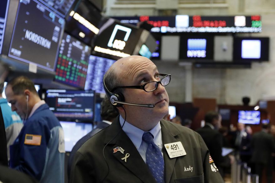 FILE- In this Feb. 22, 2019, file photo trader Andrew Silverman works on the floor of the New York Stock Exchange. The U.S. stock market opens at 9:30 a.m. EST on Thursday, March 7. (AP Photo/Richard Drew, File)