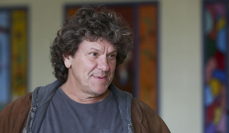 FILE - In this Wednesday, Oct. 14, 2015, file photo, Michael Lang speaks during a tour at the former Zena Elementary School in Woodstock, N.Y. Woodstock co-founder Michael Lang says the wait is almost over regarding performers for Woodstock 50, despite media reports claiming Jay-Z, Black Keys and others will perform at the event in August. The original Woodstock concert took place in 1969. On Thursday, March 7, 2019, Variety reported that Jay-Z, Black Keys, Dead & Company, Chance the Rapper, Imagine Dragons, the Killers, Gary Clark Jr. and others will perform at Woodstock 50.(AP Photo/Mike Groll, File)