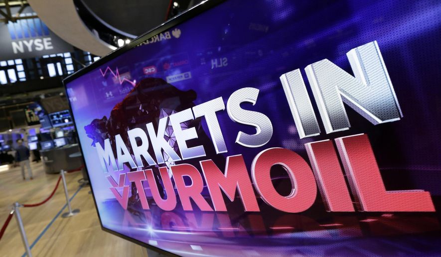 FILE- In this Aug. 24, 2015, file photo a television screen on the floor of the New York Stock Exchange displays market news as world stock markets plunged after China's main index sank 8.5 percent. Since rising from the rubble of the financial crisis in 2009, this bull market has faced several near-death experiences. Worries about everything from debt problems in Europe to the global trade war have nearly derailed it at various points over the past decade. (AP Photo/Richard Drew, File)