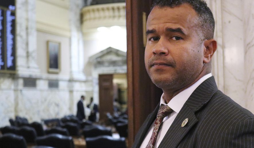 In this Feb. 28, 2019 photo, Del. C.T. Wilson stands outside the Maryland House of Delegates in Annapolis, Md. Wilson, a survivor of child sexual abuse who has spoken of his experience as he has advocated for laws to protect children, is sponsoring legislation in Maryland to prevent teachers with records of sexual misconduct against students from moving from one school to another. Maryland has taken a step toward joining a growing number of states that have enacted legislation to prevent teachers with records of sexual misconduct from moving from school to school. The Maryland House of Delegates unanimously approved a bill Thursday, March 7, 2019 to ban nondisclosure agreements involving sexual abuse for school employees who have direct contact with children. (AP Photo/Brian Witte)