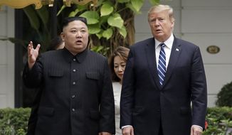 In this Feb. 28, 2019, file photo, U.S President Donald Trump, right, and North Korean leader Kim Jong-un take a walk after their first meeting at the Sofitel Legend Metropole Hanoi hotel, in Hanoi, Vietnam. North Korea&#39;s state TV on Wednesday, March 6, 2019, has aired a documentary glorifying leader Kim&#39;s recent visit to Vietnam that omitted the failed nuclear negotiations with Trump. (AP Photo/Evan Vucci, File)