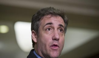 FILE - In this March 6, 2019 file photo, Michael Cohen, President Donald Trump&#39;s former lawyer, speaks as he departs after testifying before a closed-door session of the House Intelligence Committee on Capitol Hill,  in Washington.  Cohen sues the Trump Organization, on Thursday, March 7, saying he is owed $1.9 million.(AP Photo/Alex Brandon, File)