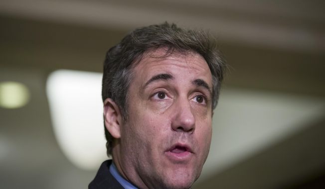 FILE - In this March 6, 2019 file photo, Michael Cohen, President Donald Trump&#x27;s former lawyer, speaks as he departs after testifying before a closed-door session of the House Intelligence Committee on Capitol Hill,  in Washington.  Cohen sues the Trump Organization, on Thursday, March 7, saying he is owed $1.9 million.(AP Photo/Alex Brandon, File)