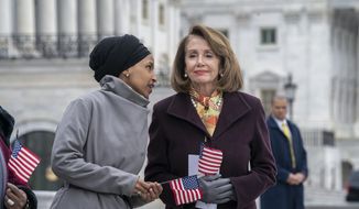 Rep. Ilhan Omar, D-Minn., left, whispers to Speaker of the House Nancy Pelosi, D-Calif., as Democrats rally outside the Capitol ahead of passage of H.R. 1, &quot;The For the People Act,&quot; a bill which aims to expand voting rights and strengthen ethics rules, in Washington, Friday, March 8, 2019. (AP Photo/J. Scott Applewhite) **FILE**