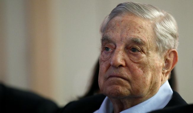 In this May 29, 2018, file photo, George Soros, founder and chairman of the Open Society Foundations, listens to the conference after his speech titled &quot;How to save the European Union&quot; as he attends the European Council On Foreign Relations Annual Council Meeting in Paris. (AP Photo/Francois Mori) ** FILE **