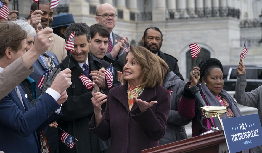 Speaker of the House Nancy Pelosi, D-Calif., and House Democrats rally ahead of passage of H.R. 1, &amp;quot;The For the People Act,&amp;quot; at the Capitol in Washington, Friday, March 8, 2019. Rep. John Sarbanes, D-Md., the bill&#39;s sponsor, stands behind Pelosi at left. The bill aims to expand voting rights, limit partisan gerrymandering, strengthen ethics rules, and limit the influence of private donor money in politics. (AP Photo/J. Scott Applewhite)