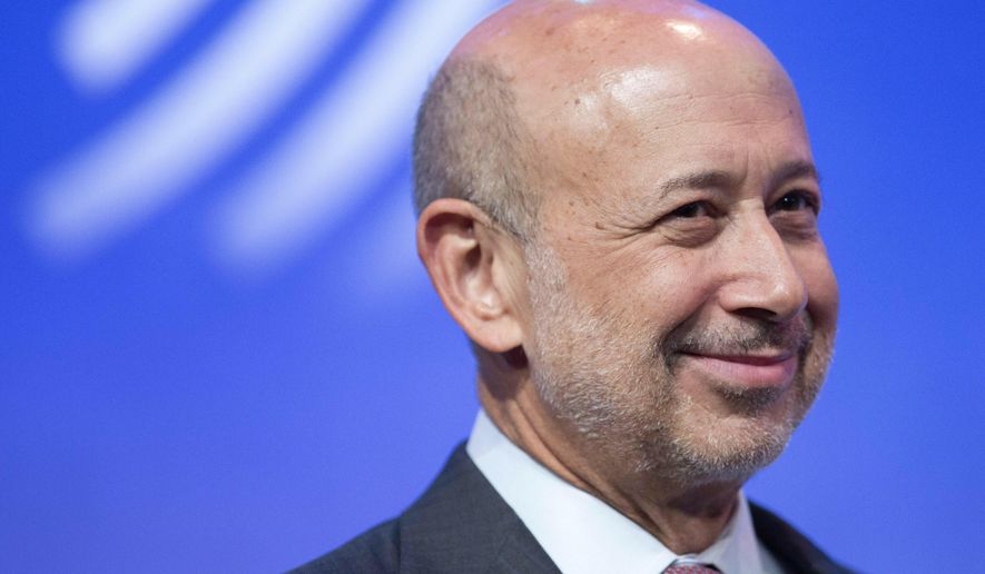 In this Sept. 24, 2014, file photo Lloyd Blankfein, Chairman and CEO of Goldman Sachs, speaks in a panel discussion at the Clinton Global Initiative in New York. Business casual has become such an entrenched trend that even Goldman Sachs surrendered to it with a memo to employees announcing flexible dress code. Solomon, who likes to emphasize his side gig as DJ, has been known to show up tieless at formal events, as have the chief executives of JP Morgan Chase and Citigroup. (AP Photo/Mark Lennihan, File)